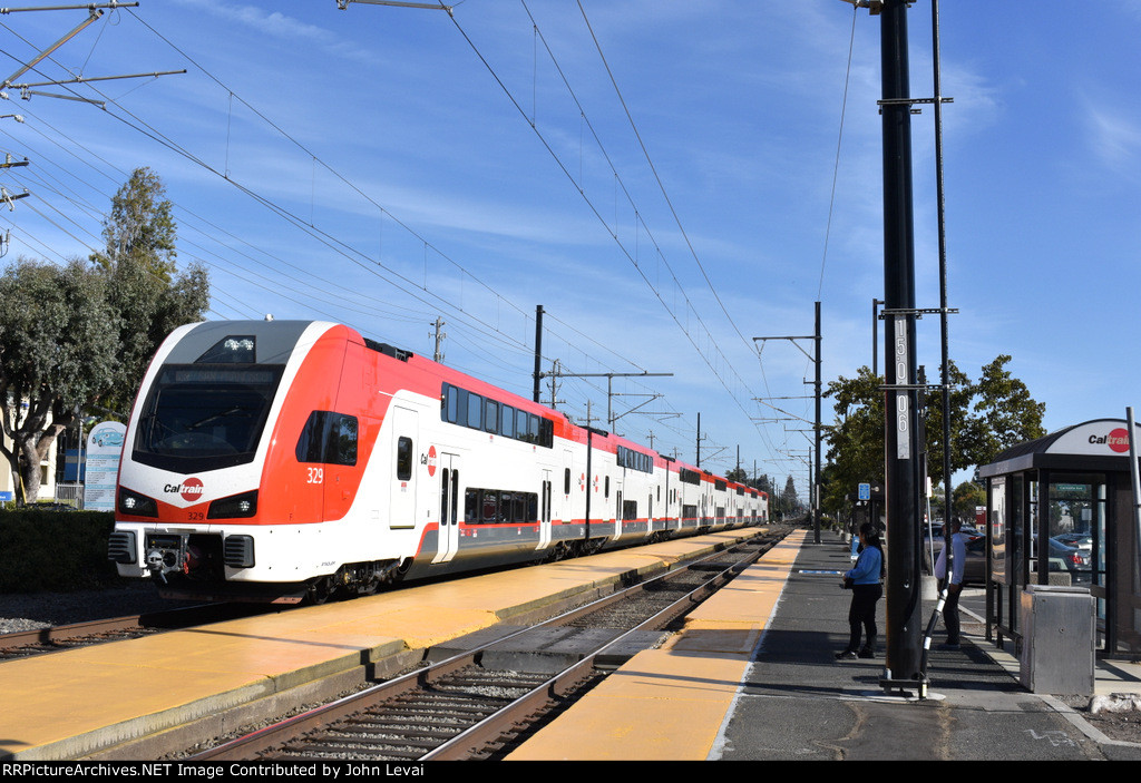 Caltrain # 631 about to make its station stop at Broadway